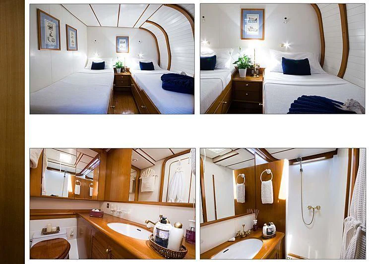 a bathroom with a sink and a bed aboard BAIURDO VI Yacht for Sale