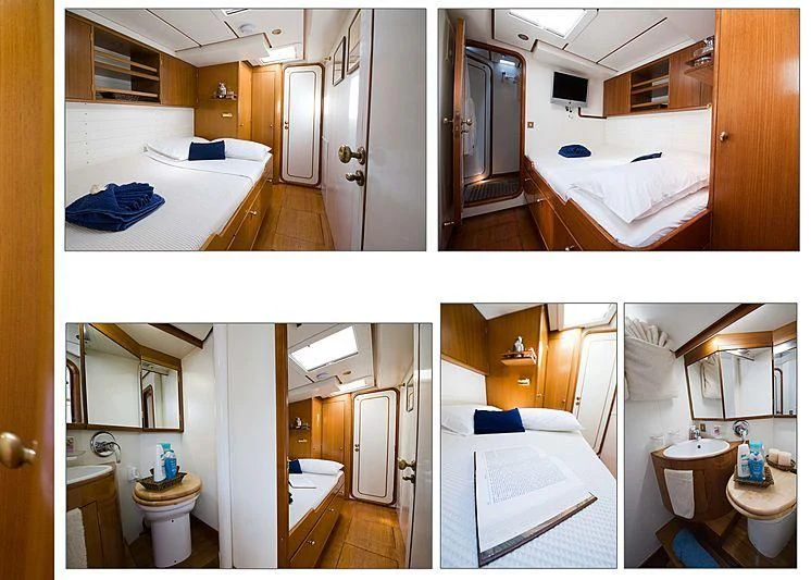 a bathroom with a large mirror aboard BAIURDO VI Yacht for Sale