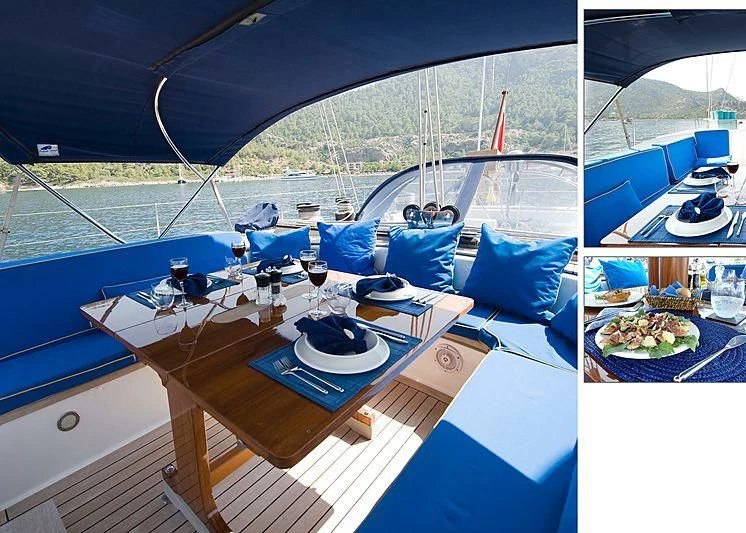 a boat with a table and chairs on the deck aboard BAIURDO VI Yacht for Sale
