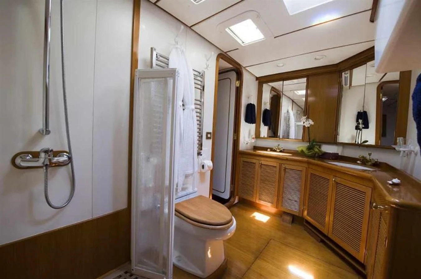 a bathroom with a shower unit and toilet aboard BAIURDO VI Yacht for Sale
