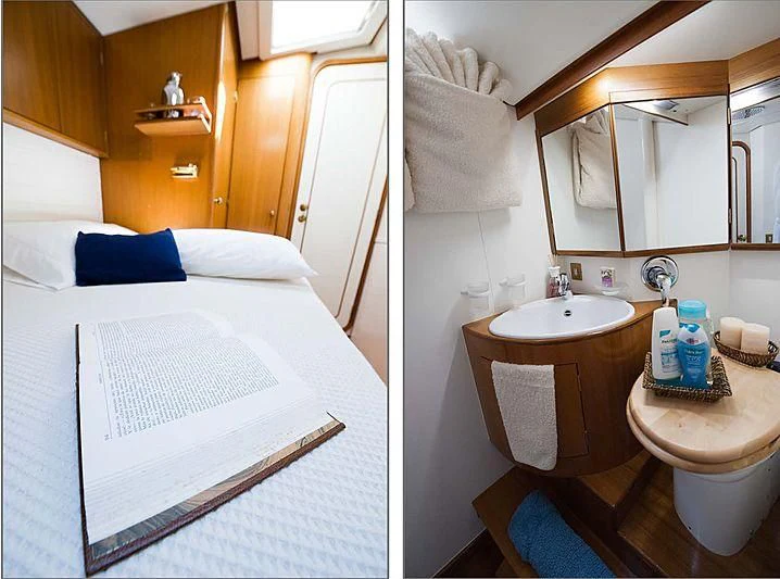a bathroom with a sink and a bed aboard BAIURDO VI Yacht for Sale