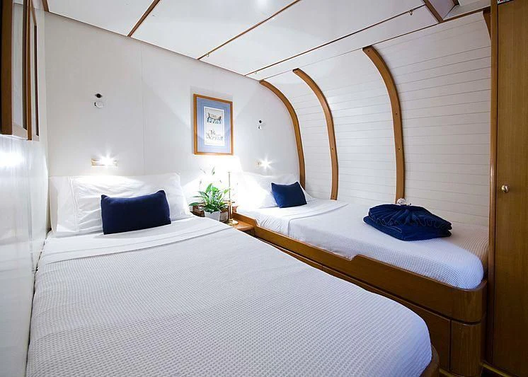 a couple of beds in a room aboard BAIURDO VI Yacht for Sale