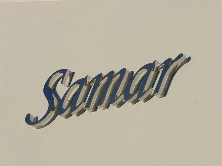 a blue logo with white text aboard SAMAR Yacht for Sale