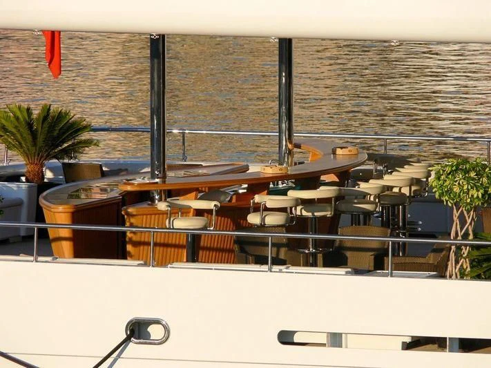 a row of tables and chairs on a deck aboard SAMAR Yacht for Sale