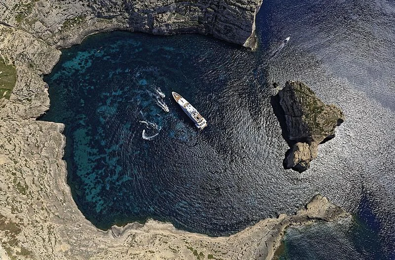 a satellite in a blue circle aboard SAMAR Yacht for Sale