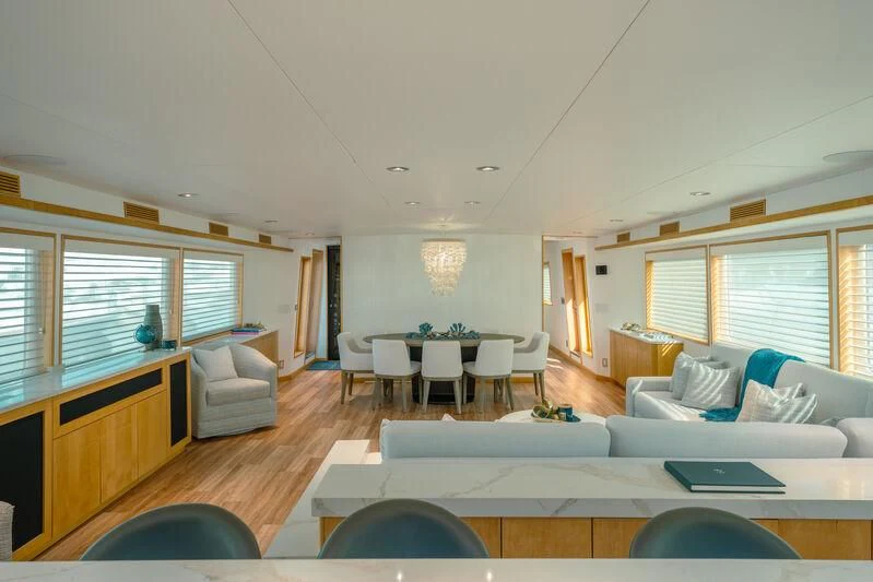 a living room with a large window aboard ALEXANDRA JANE Yacht for Sale