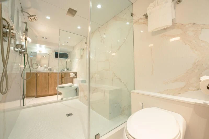 a bathroom with a glass shower aboard ALEXANDRA JANE Yacht for Sale
