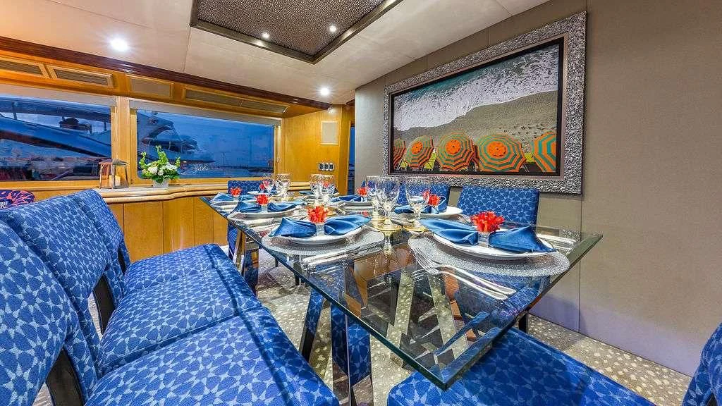 a dining room with a table and chairs aboard ALEXANDRA JANE Yacht for Sale