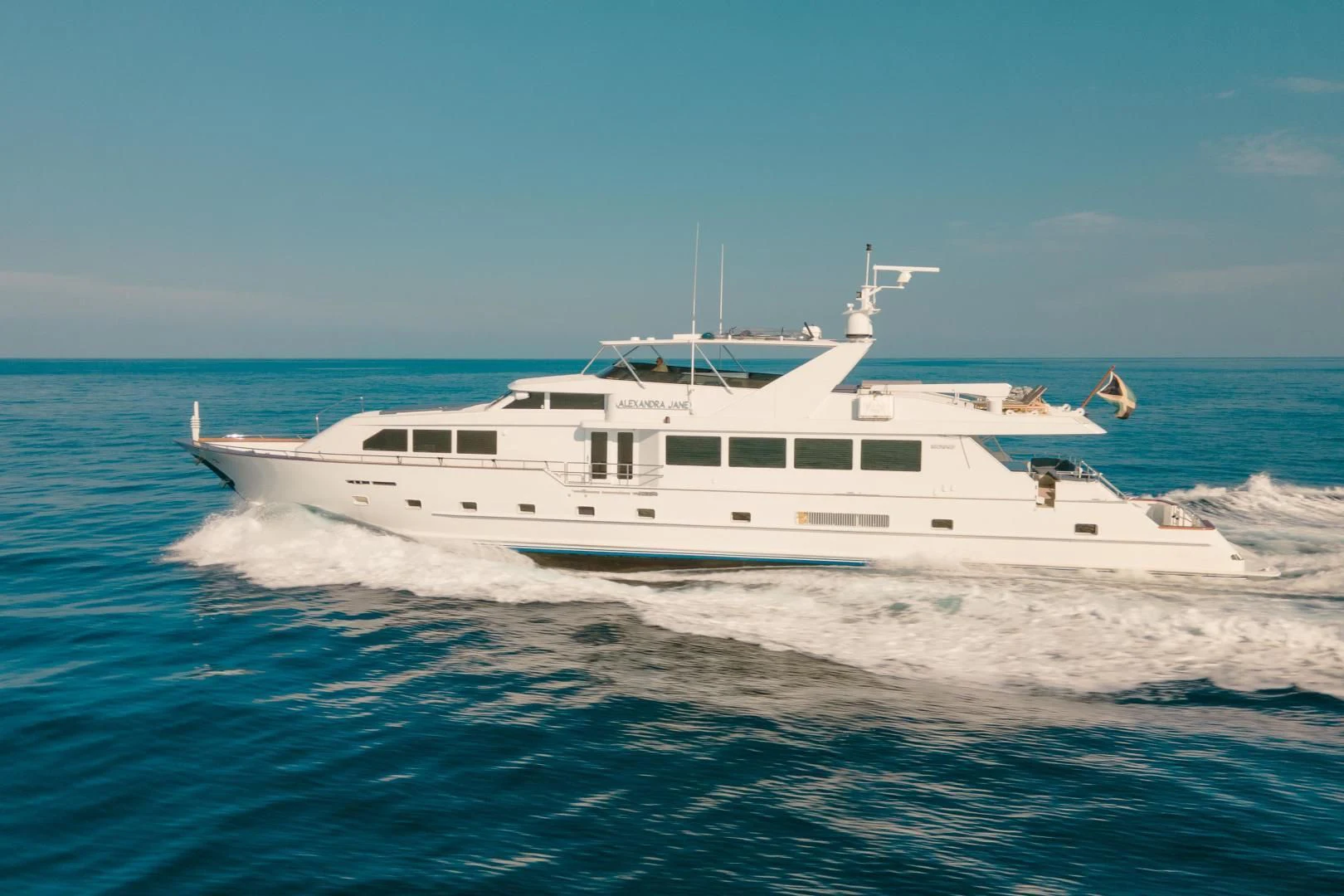 a white boat in the water aboard ALEXANDRA JANE Yacht for Sale