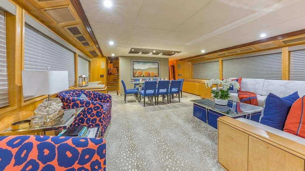 a large room with a couch and a table aboard ALEXANDRA JANE Yacht for Sale