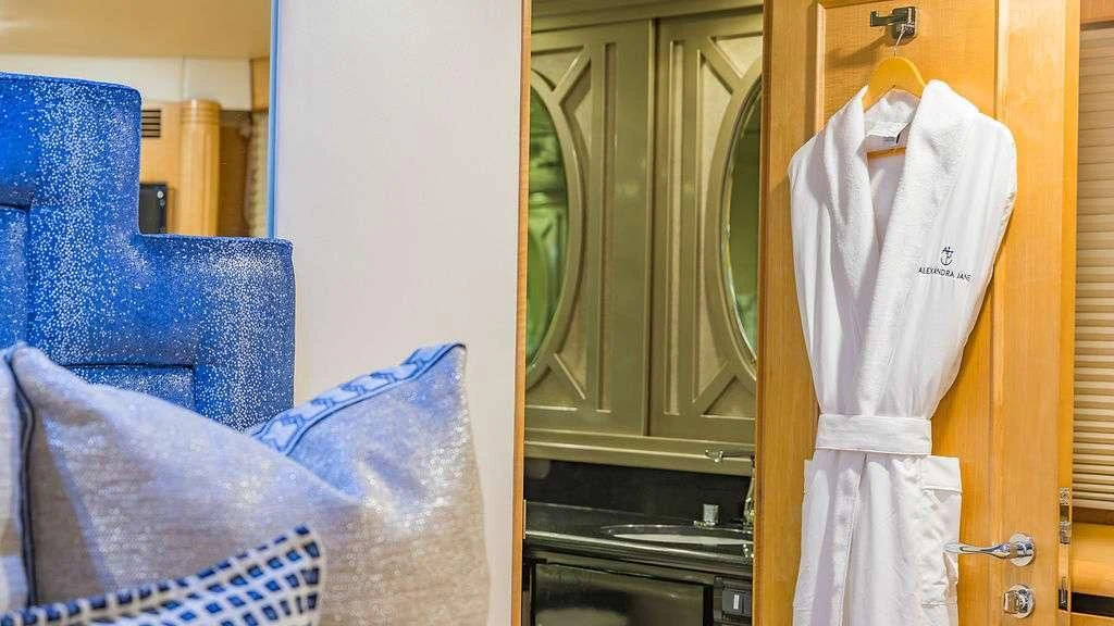 a room with a chair and a closet aboard ALEXANDRA JANE Yacht for Sale