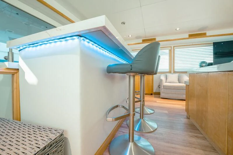 a room with a chair and a table aboard ALEXANDRA JANE Yacht for Sale