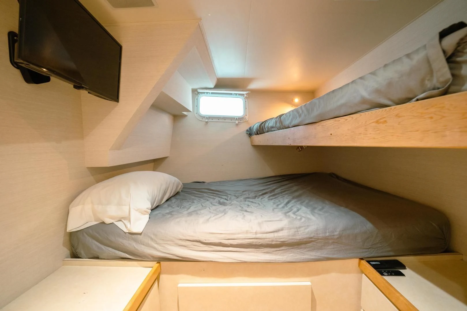 a bed with a television on top of it aboard ALEXANDRA JANE Yacht for Sale