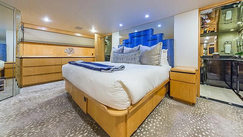 a bedroom with a large bed aboard ALEXANDRA JANE Yacht for Sale