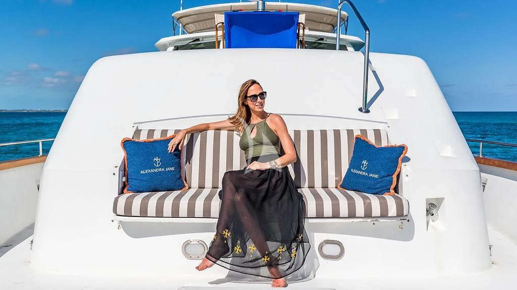 a person sitting on a boat aboard ALEXANDRA JANE Yacht for Sale