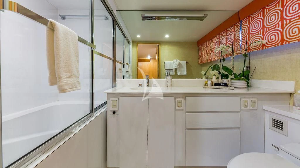 a bathroom with white cabinets aboard ALEXANDRA JANE Yacht for Sale