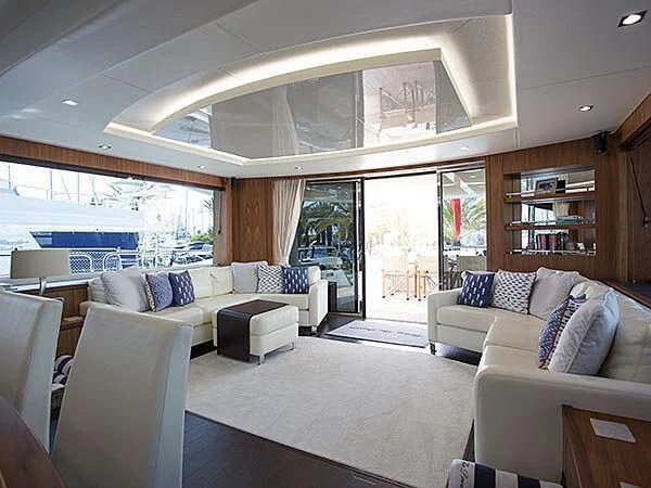 a living room with a large window aboard X-ELEVEN Yacht for Sale