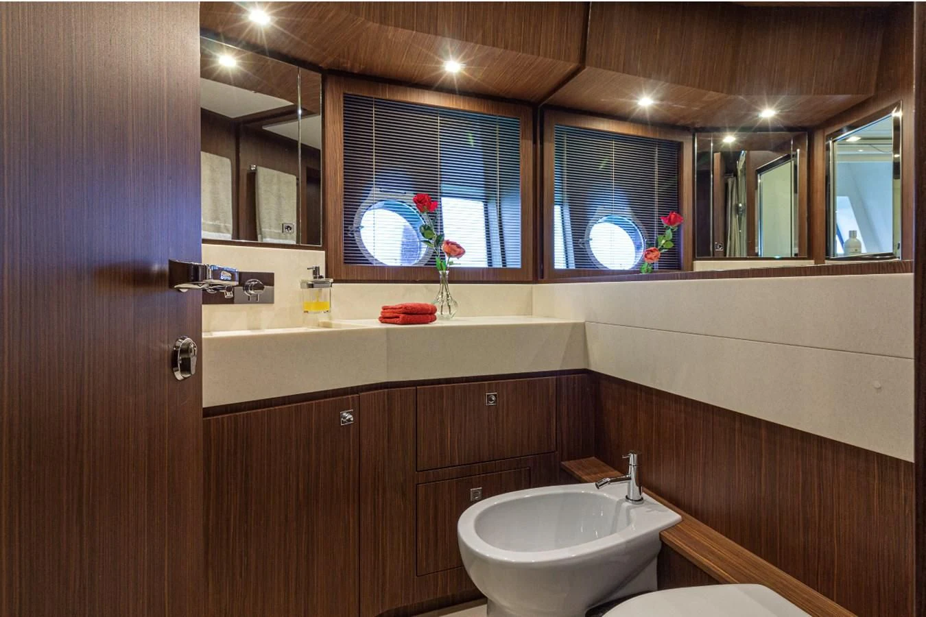 a bathroom with a sink and a mirror aboard DONNA SANTA Yacht for Sale