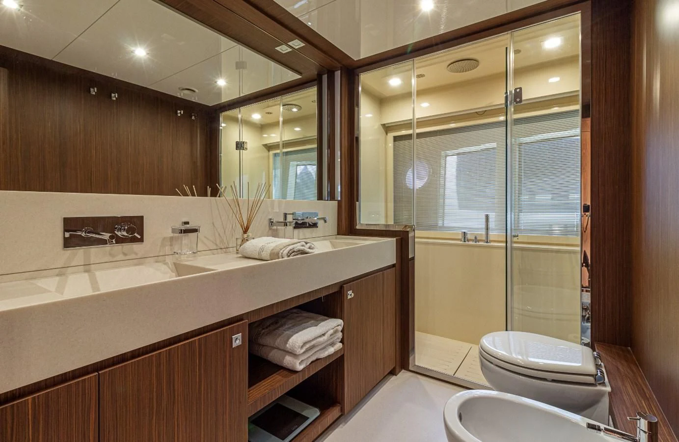 a bathroom with a large mirror aboard DONNA SANTA Yacht for Sale
