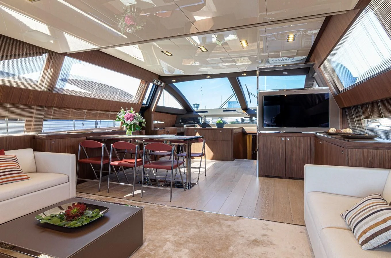 a room with a table and chairs aboard DONNA SANTA Yacht for Sale