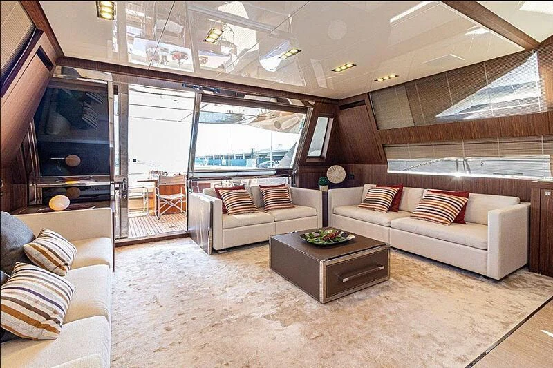 a living room with a couch and a tv aboard DONNA SANTA Yacht for Sale