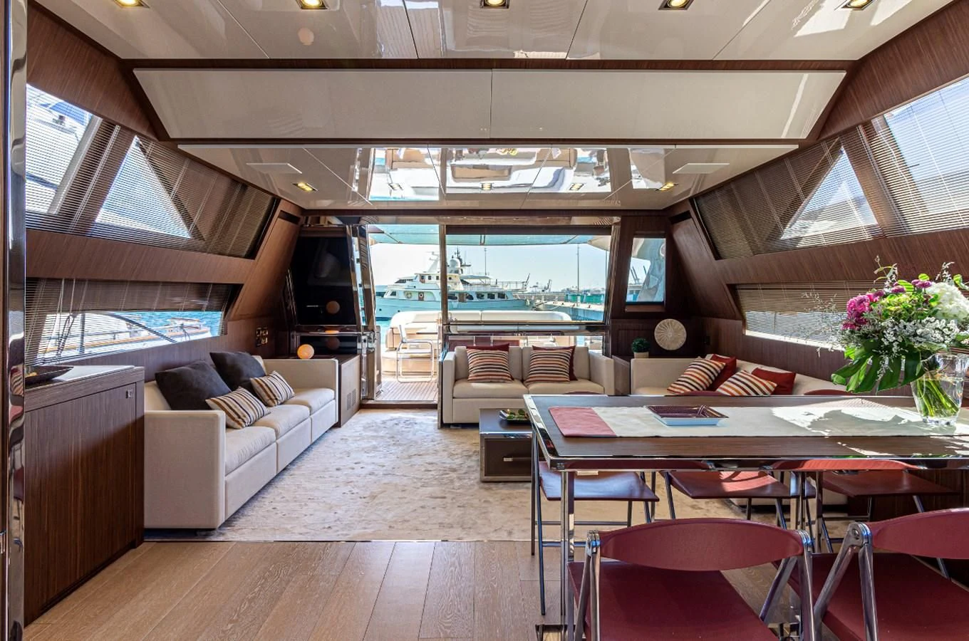 a room with a table and chairs aboard DONNA SANTA Yacht for Sale