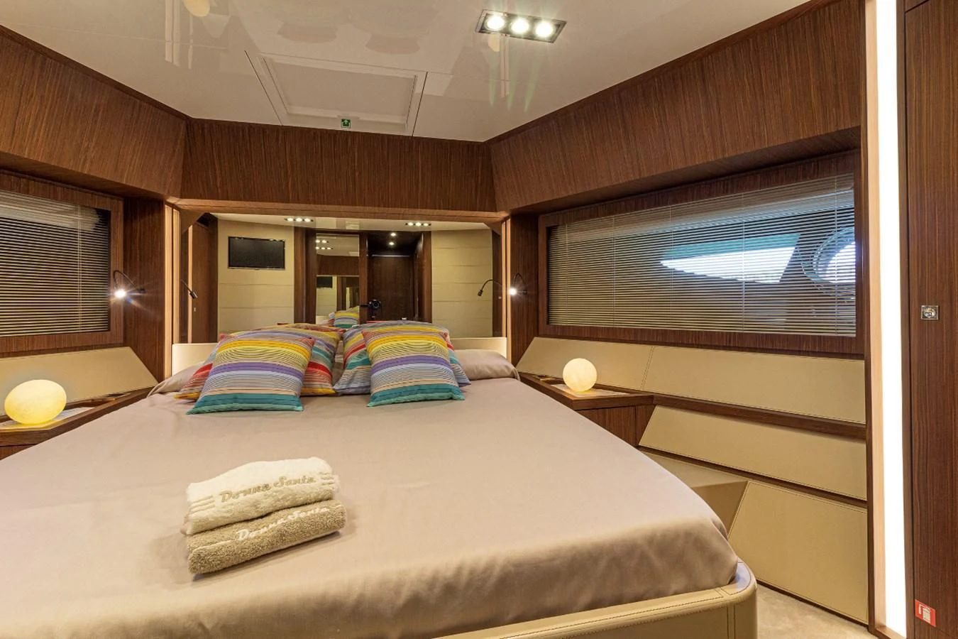 a bed with pillows on it aboard DONNA SANTA Yacht for Sale