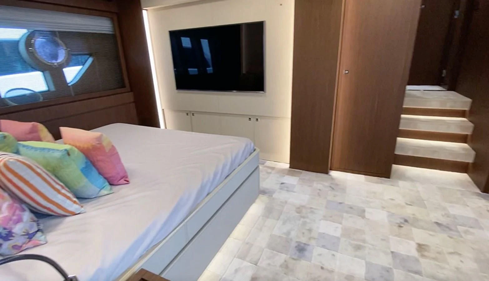 a bed with colorful pillows aboard DONNA SANTA Yacht for Sale