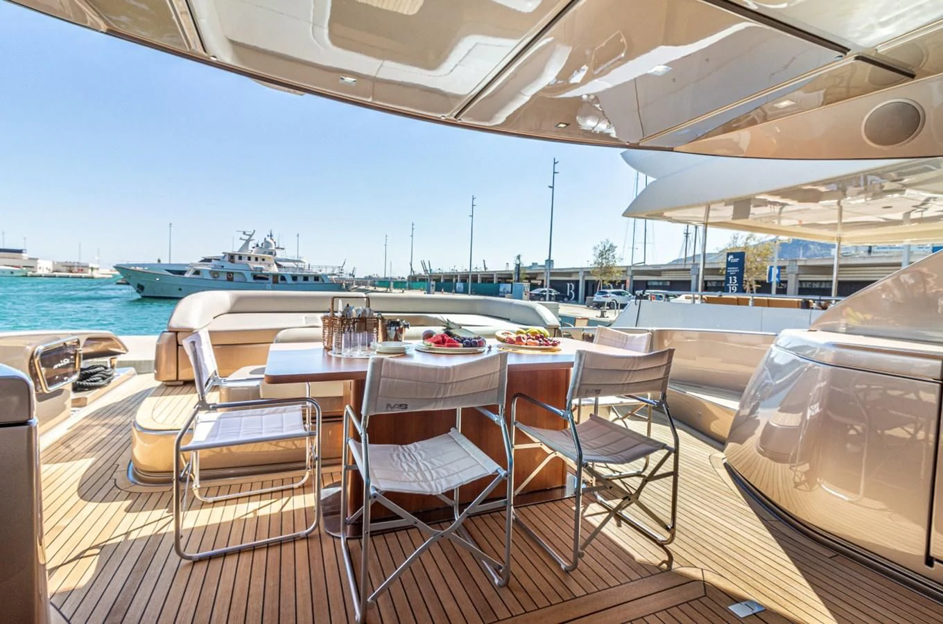 a table and chairs on a deck aboard DONNA SANTA Yacht for Sale