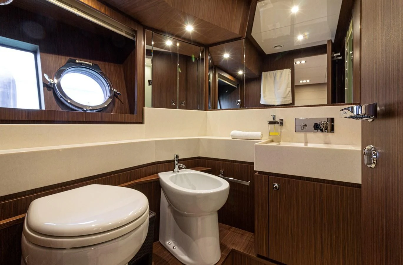 a bathroom with a large mirror aboard DONNA SANTA Yacht for Sale