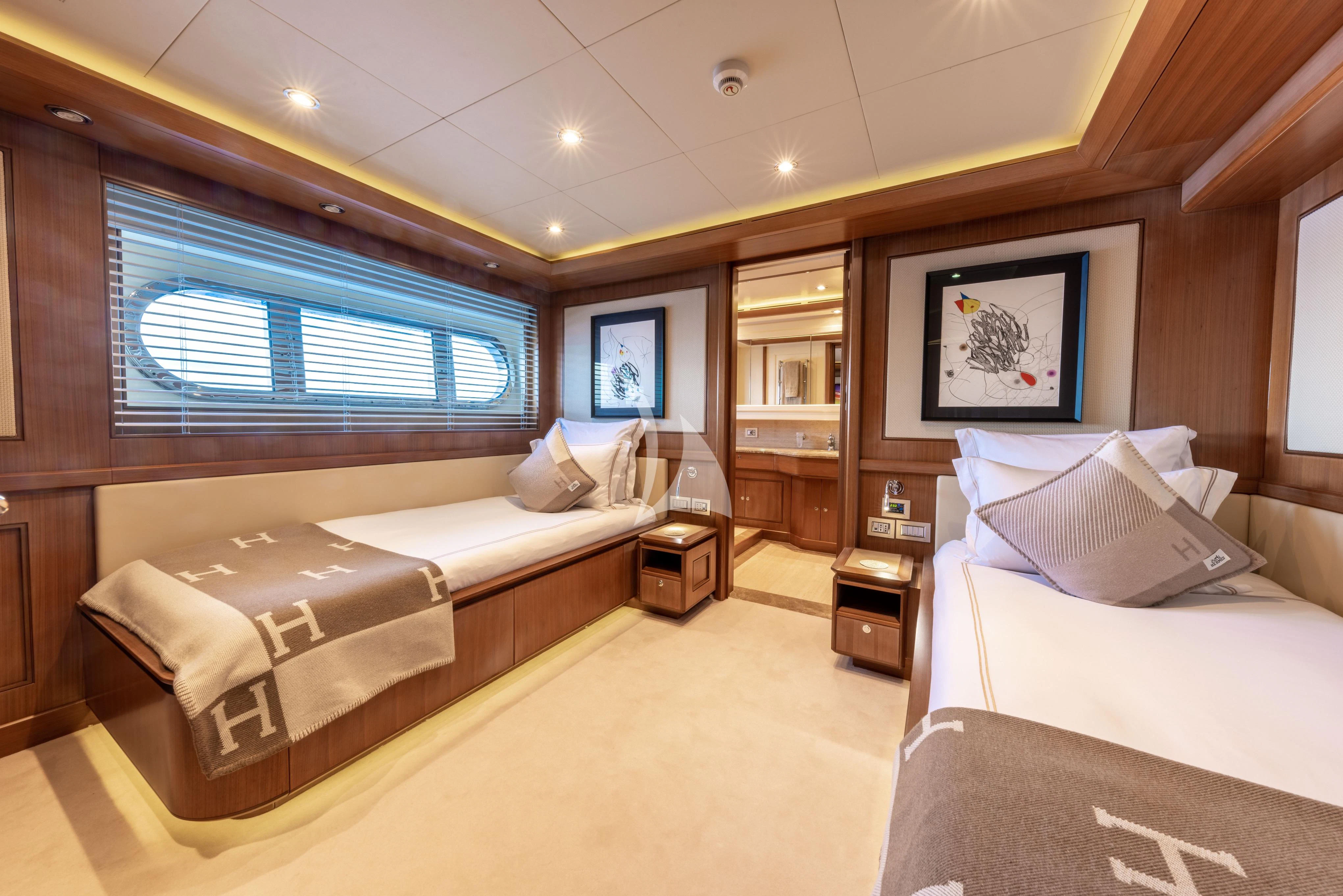 a room with a bed and a large mirror aboard O'LION Yacht for Sale