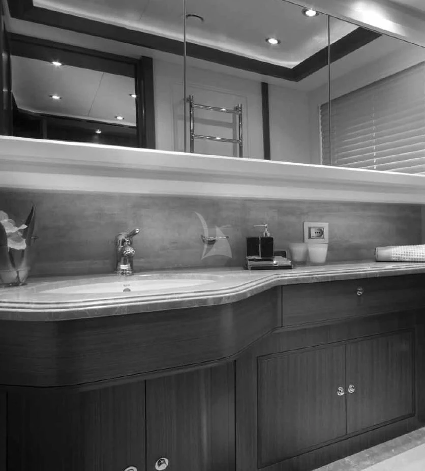 a bathroom with a sink and a mirror aboard O'LION Yacht for Sale