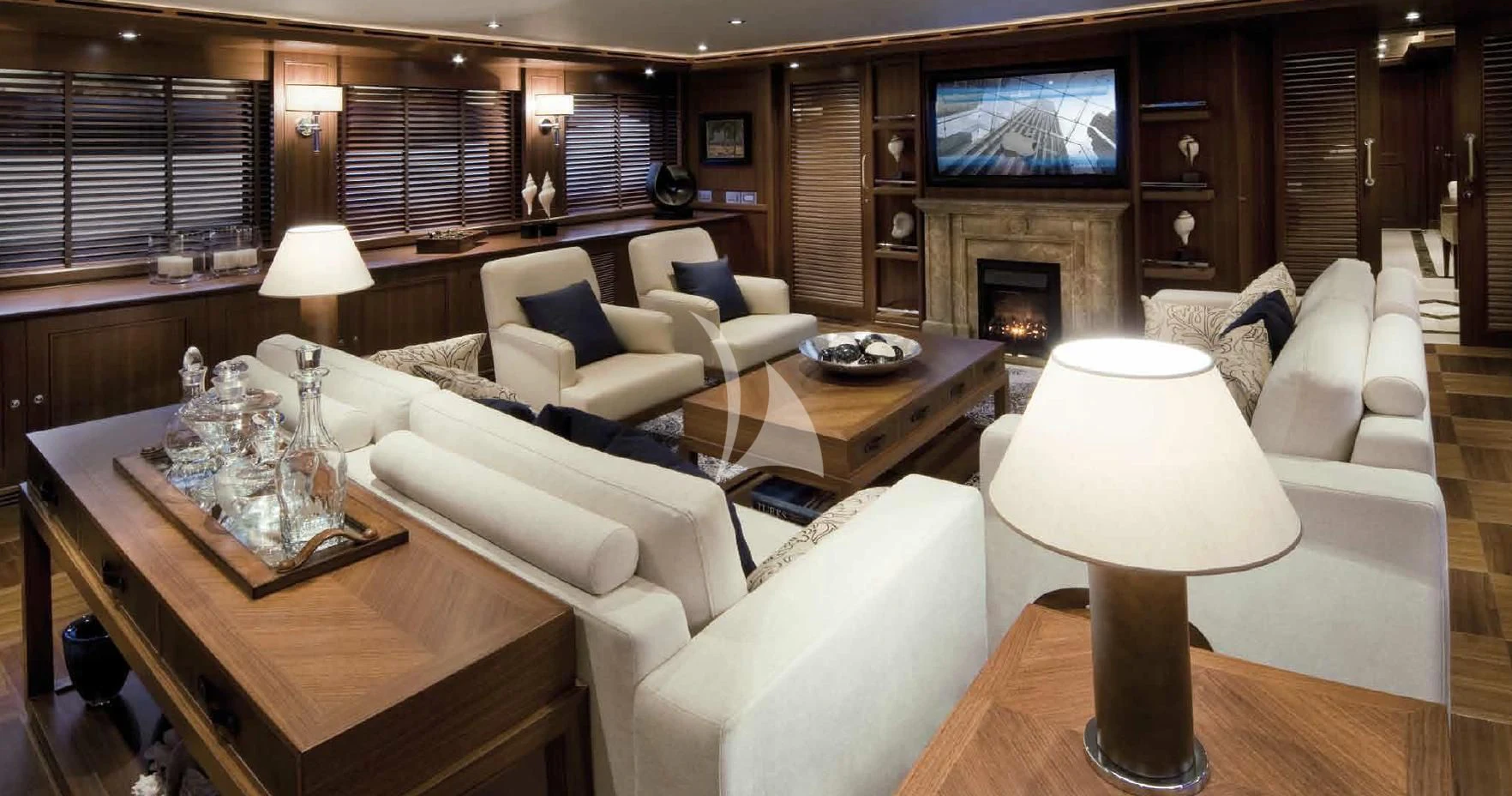 a living room with a fireplace aboard O'LION Yacht for Sale