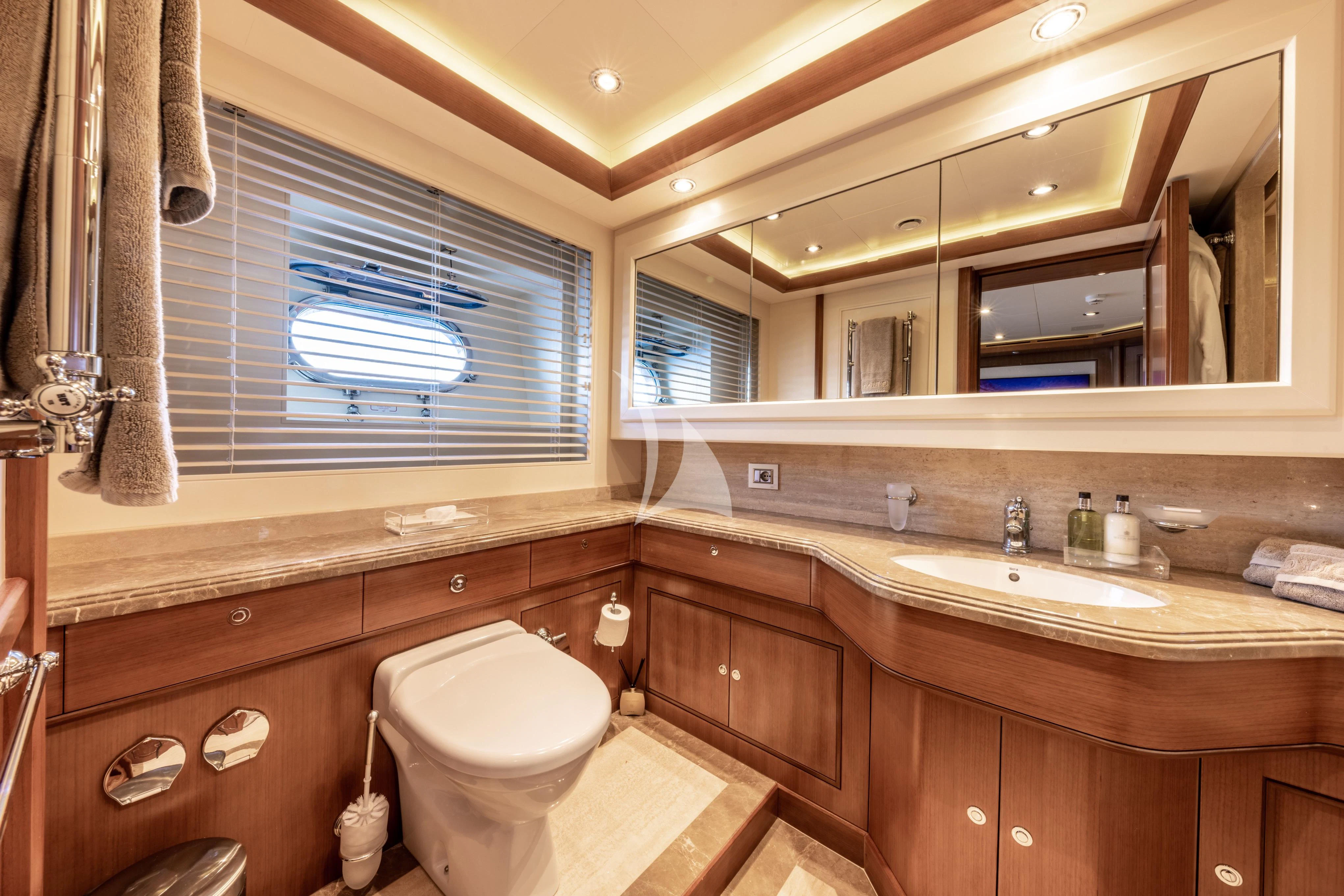a bathroom with a sink and a toilet aboard O'LION Yacht for Sale