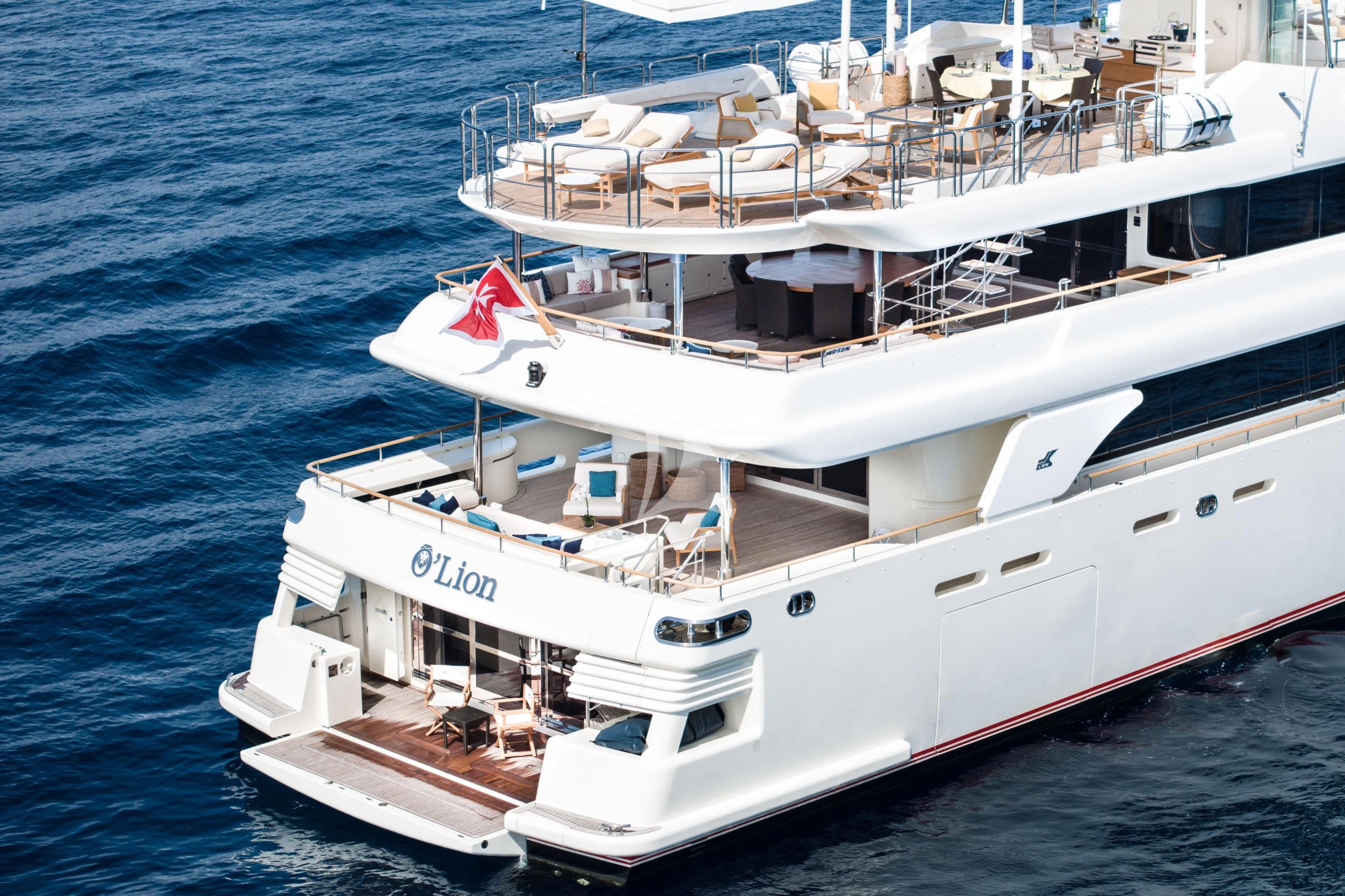 a large white boat on the water aboard O'LION Yacht for Sale