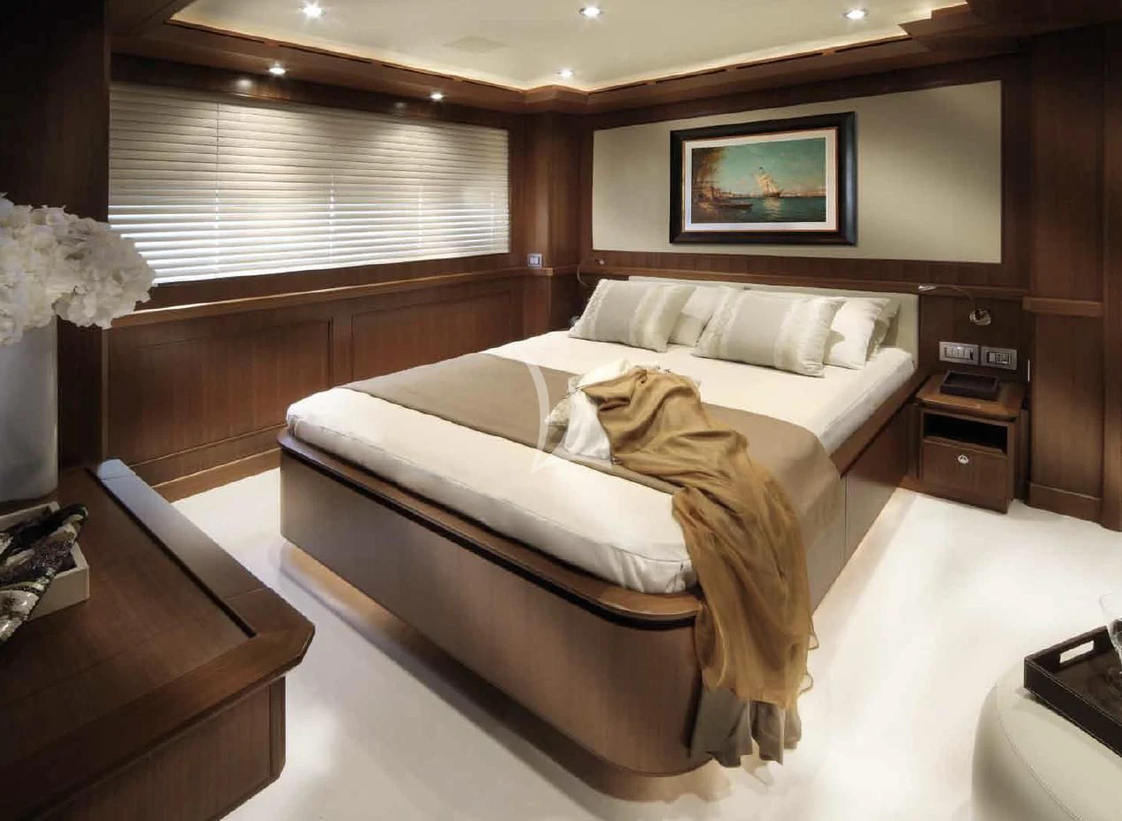 a bed in a room aboard O'LION Yacht for Sale
