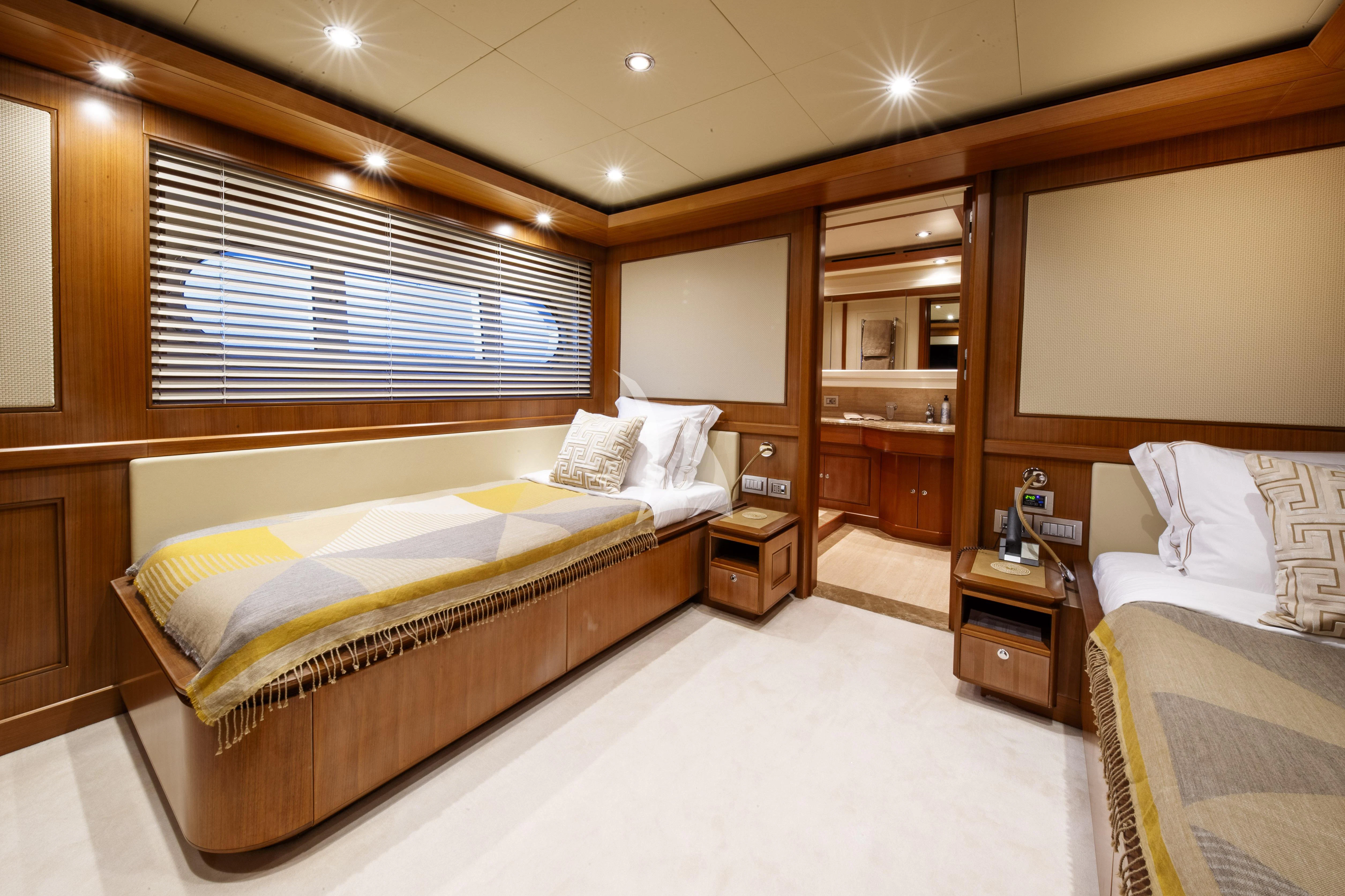 a room with two beds aboard O'LION Yacht for Sale