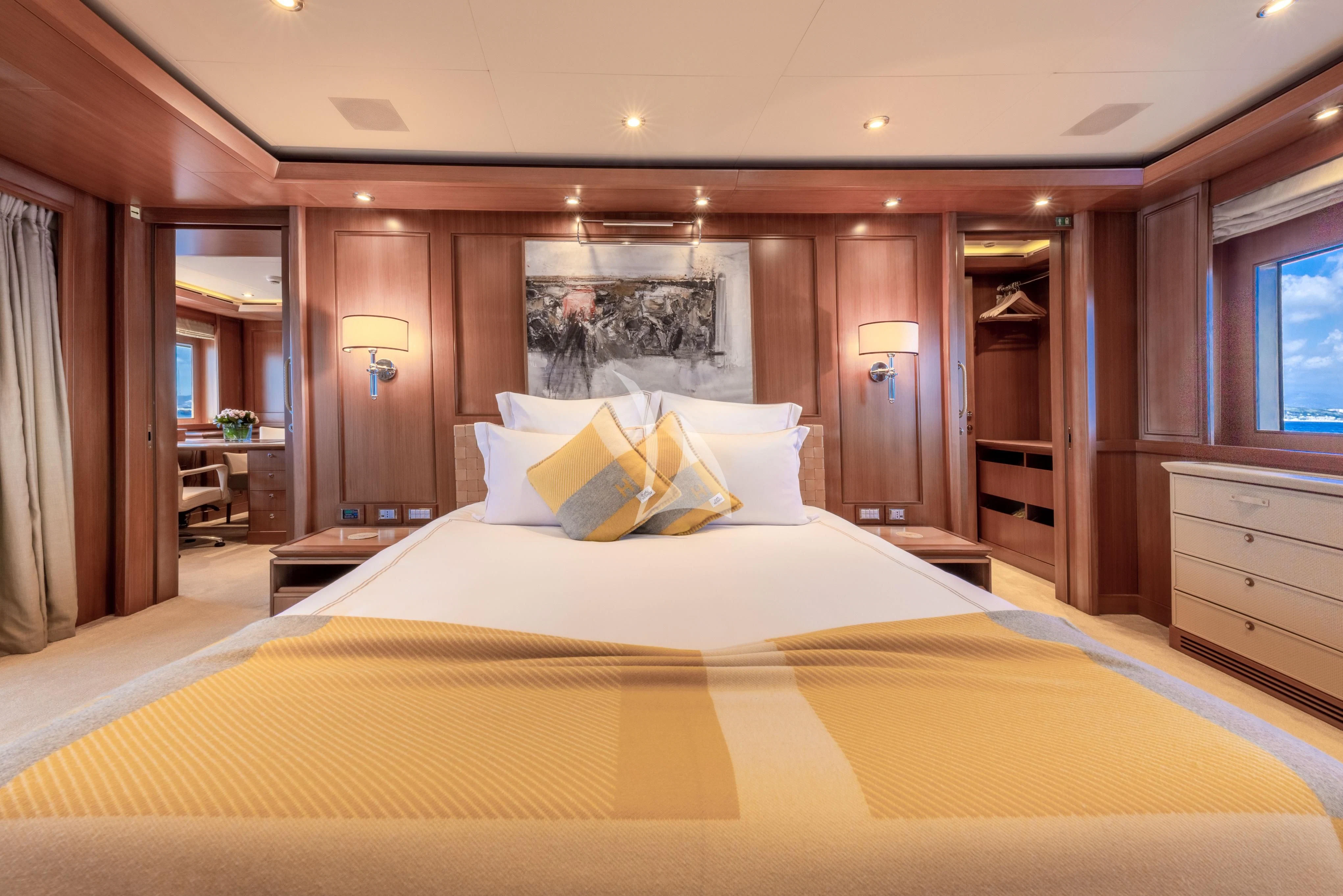 a large bed in a hotel room aboard O'LION Yacht for Sale