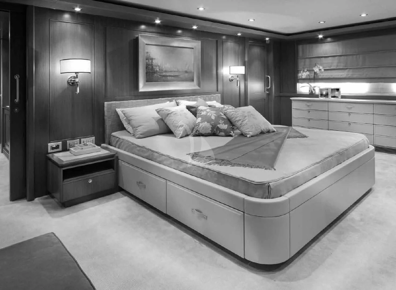 a large bed in a hotel room aboard O'LION Yacht for Sale