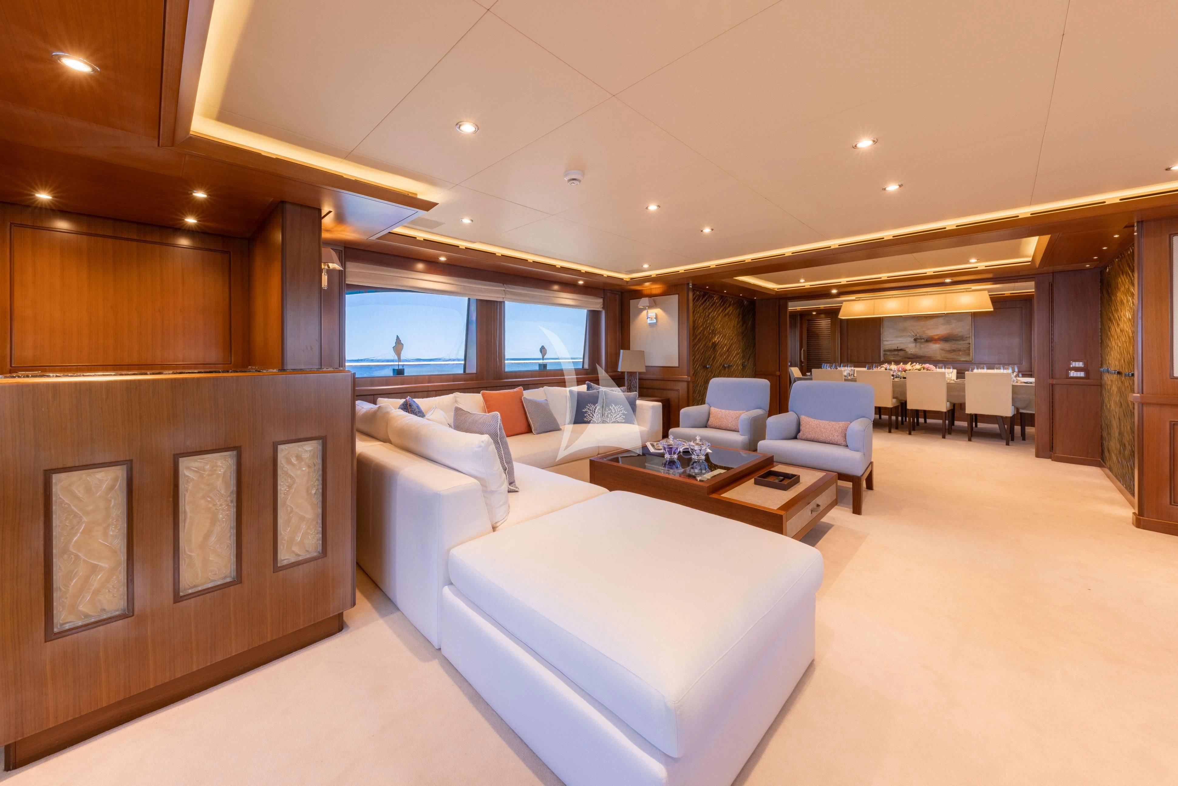 a room with a bed and a couch aboard O'LION Yacht for Sale