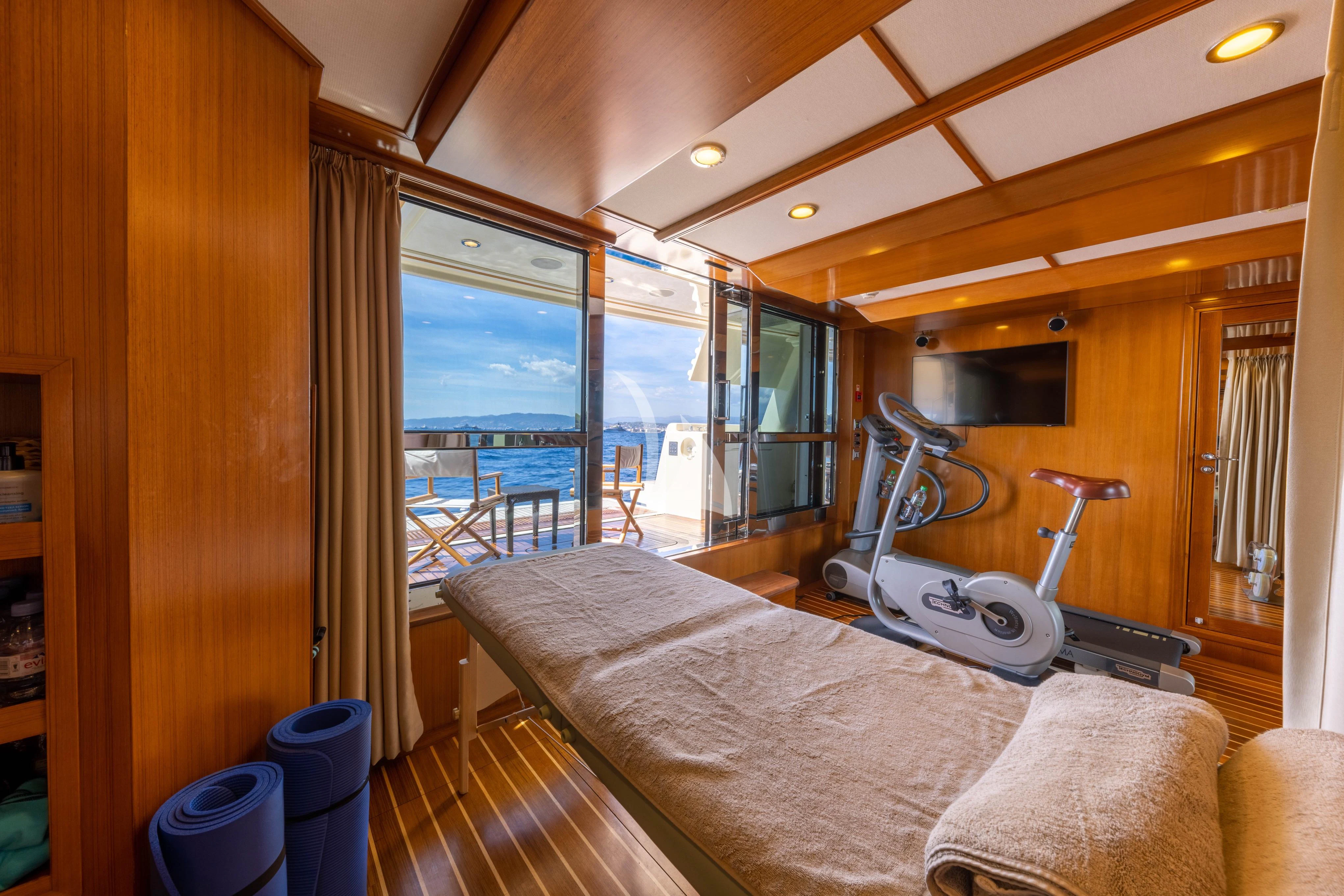 a bed in a room aboard O'LION Yacht for Sale