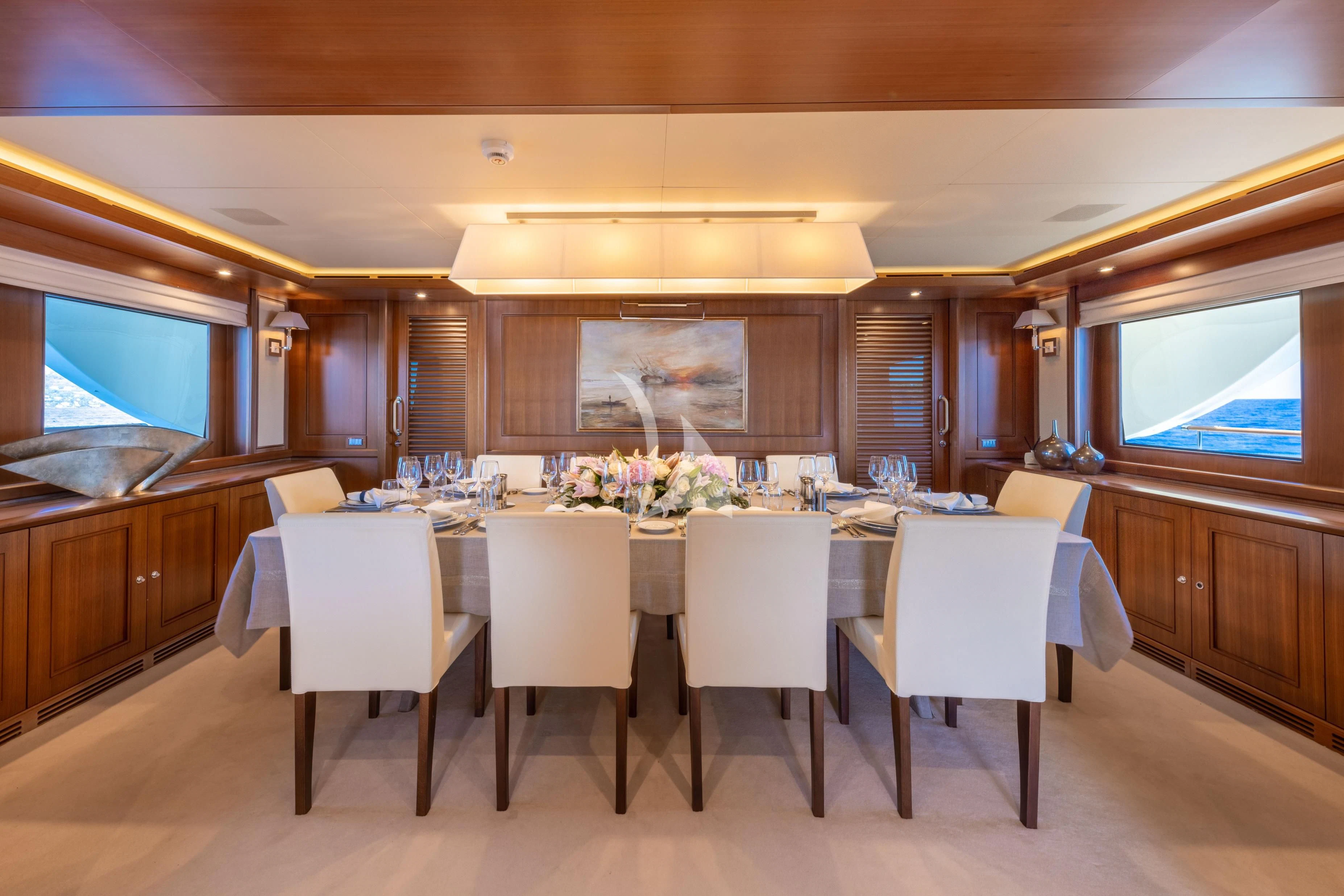 a large kitchen with a large table aboard O'LION Yacht for Sale