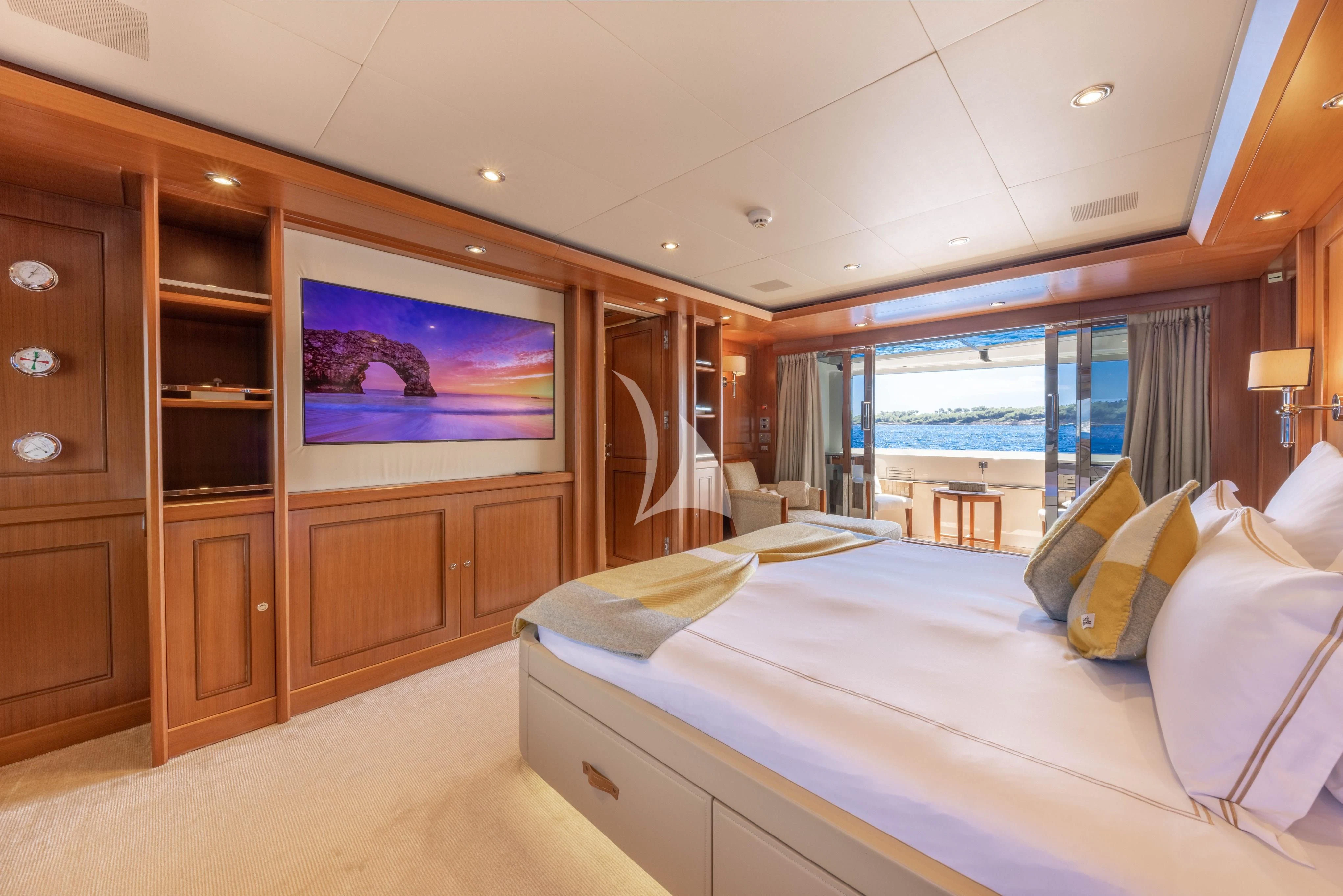 a hotel room with a bed and a tv aboard O'LION Yacht for Sale