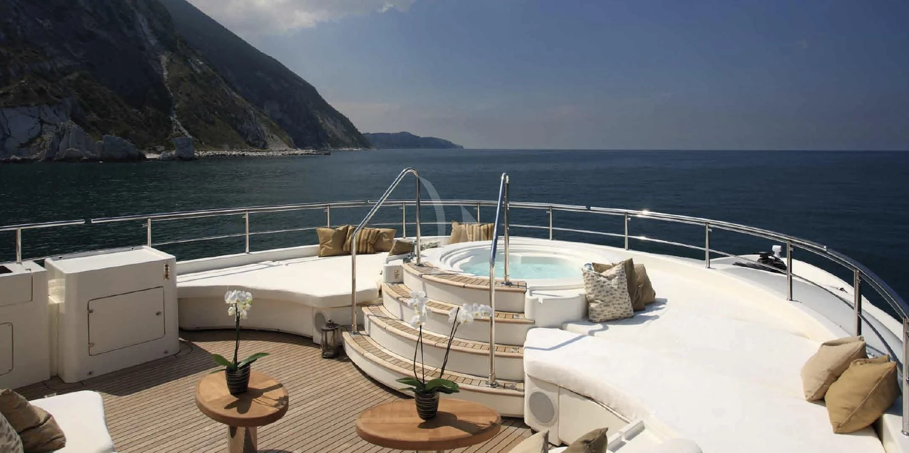 a room with a bed and a table and a chair aboard O'LION Yacht for Sale