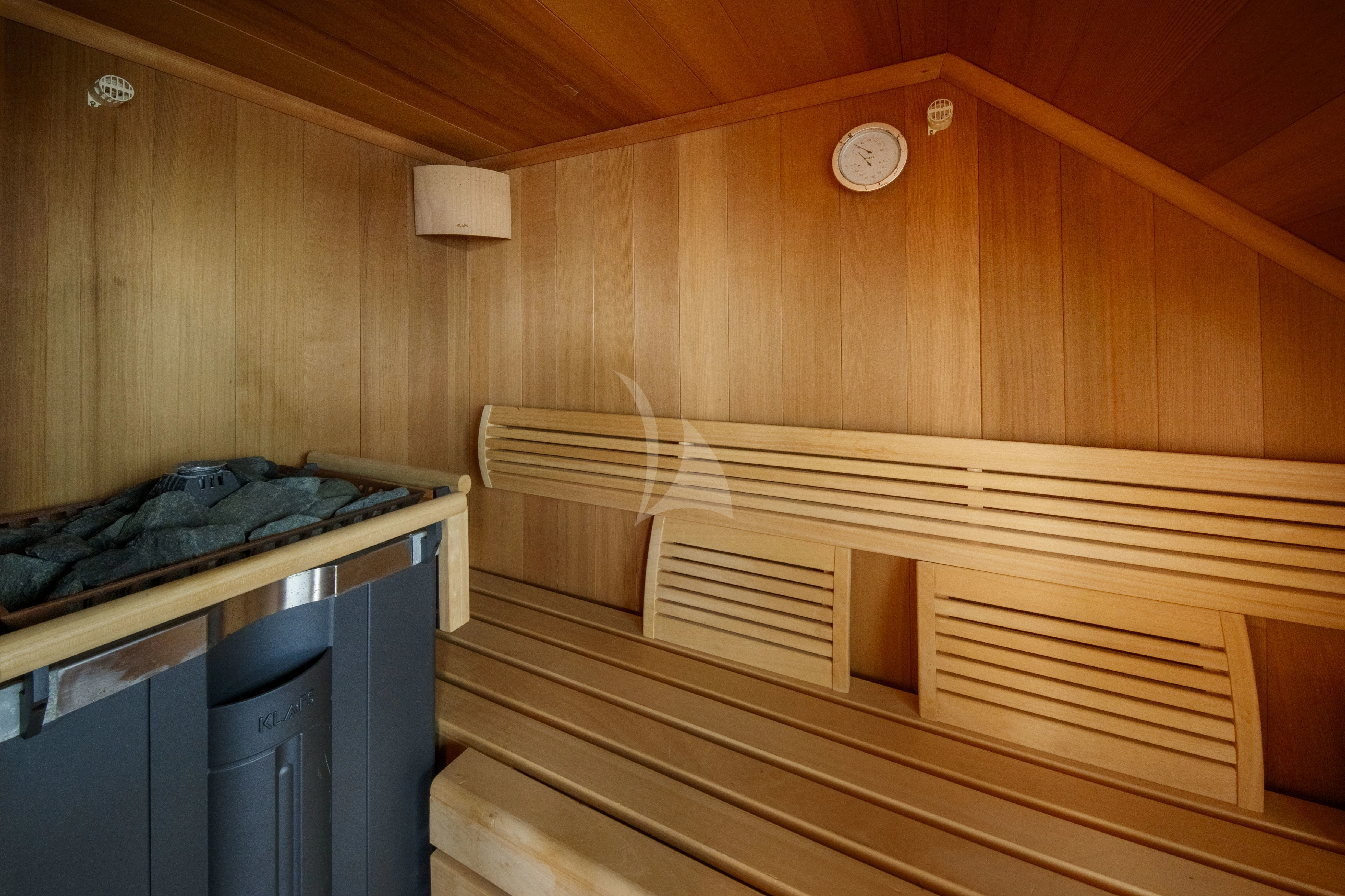 a room with wooden walls aboard O'LION Yacht for Sale