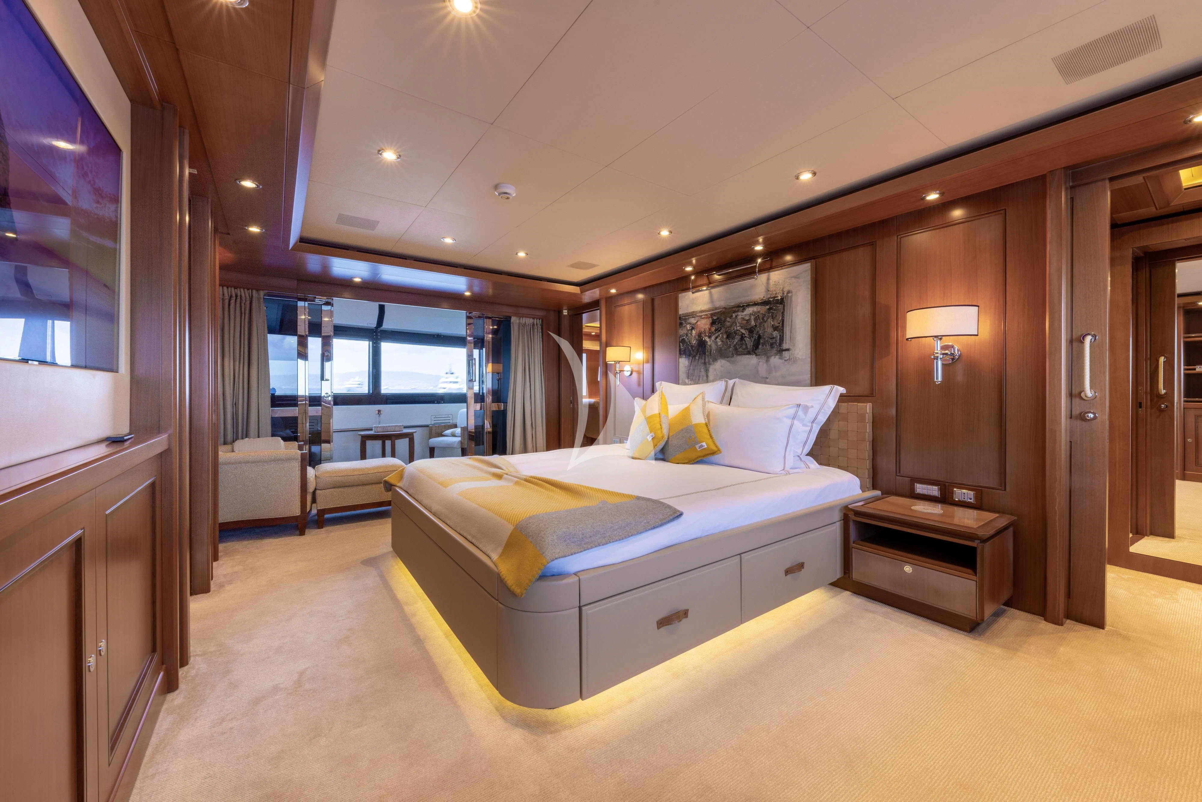 a bedroom with a large bed aboard O'LION Yacht for Sale