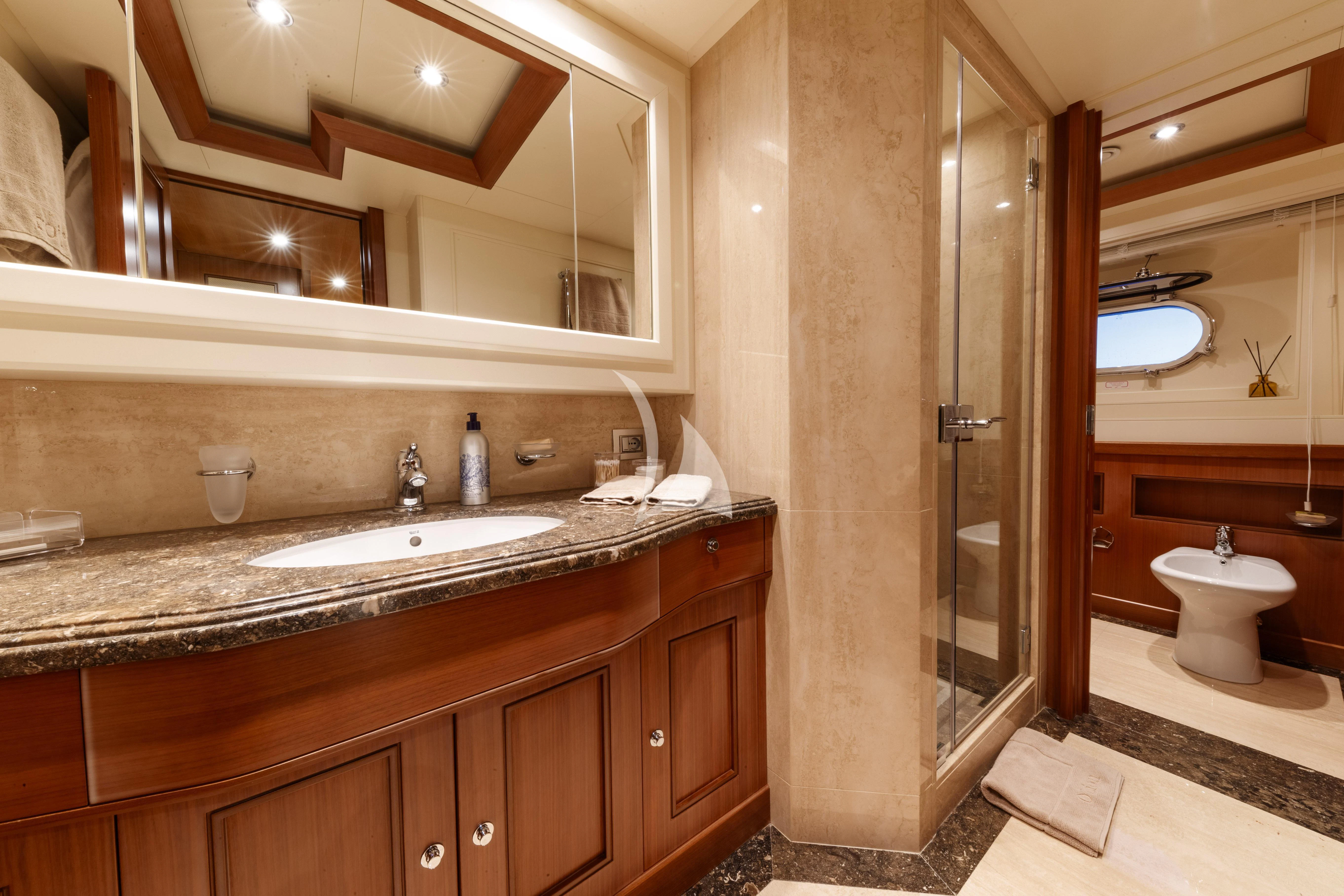 a bathroom with a large mirror aboard O'LION Yacht for Sale