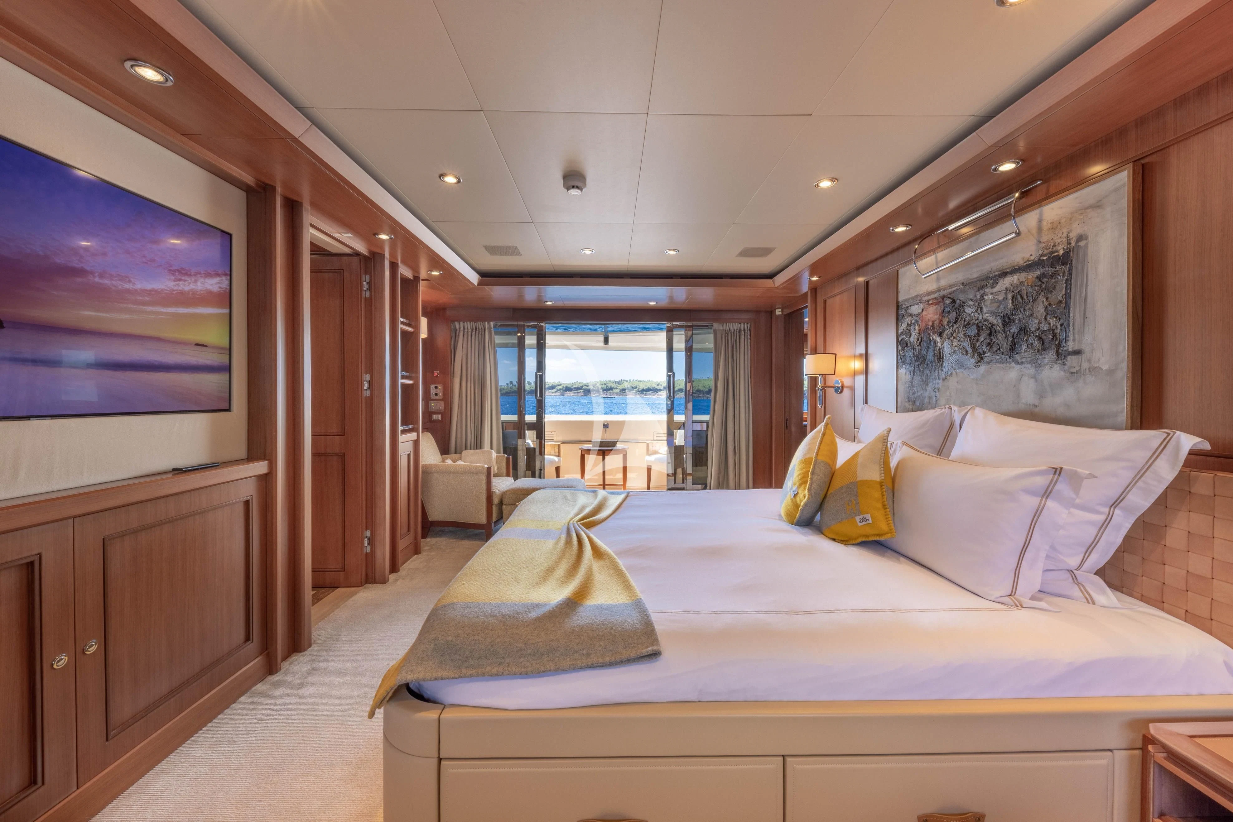 a hotel room with a bed and a tv aboard O'LION Yacht for Sale