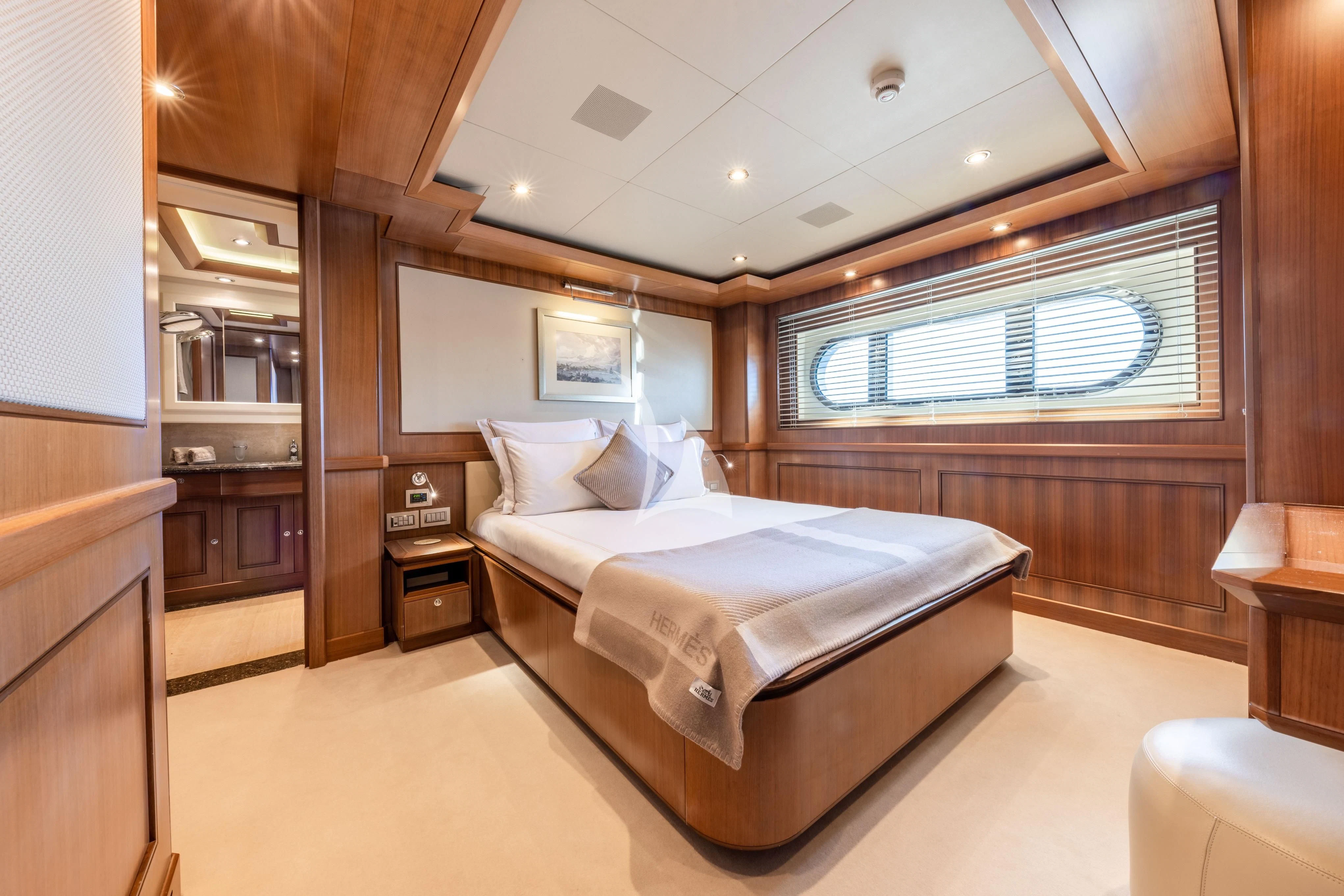 a large bedroom with a bed aboard O'LION Yacht for Sale