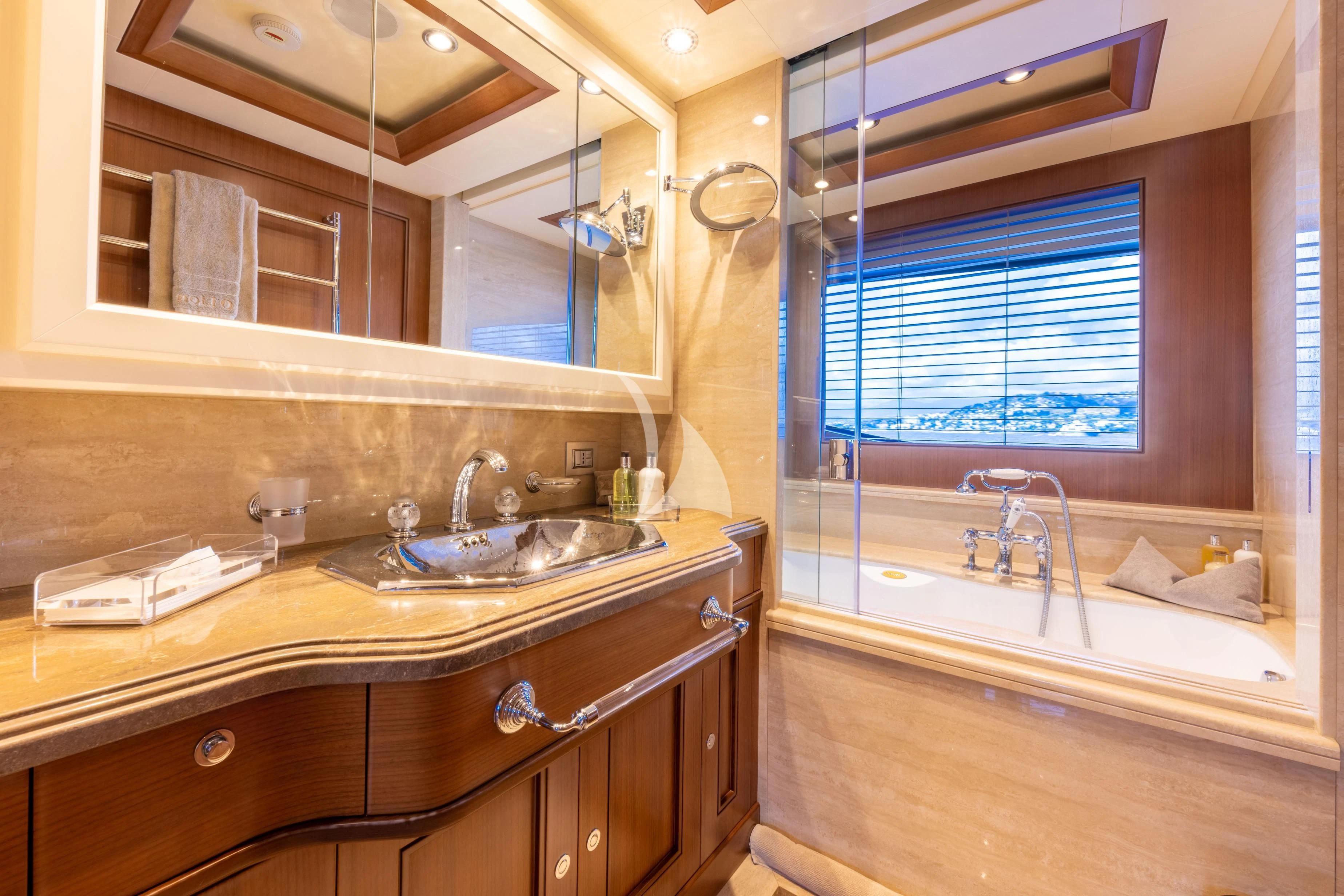 a bathroom with a large mirror aboard O'LION Yacht for Sale